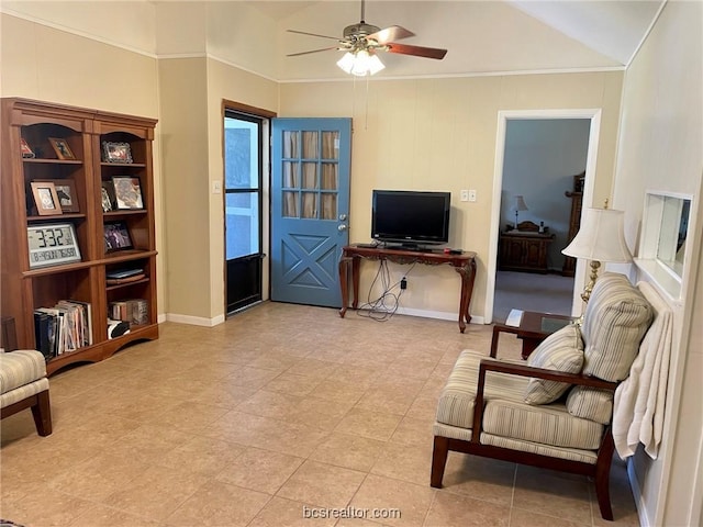 living area with ceiling fan and vaulted ceiling