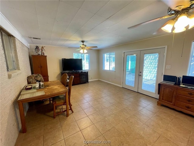 dining area featuring ceiling fan, french doors, and light tile patterned floors