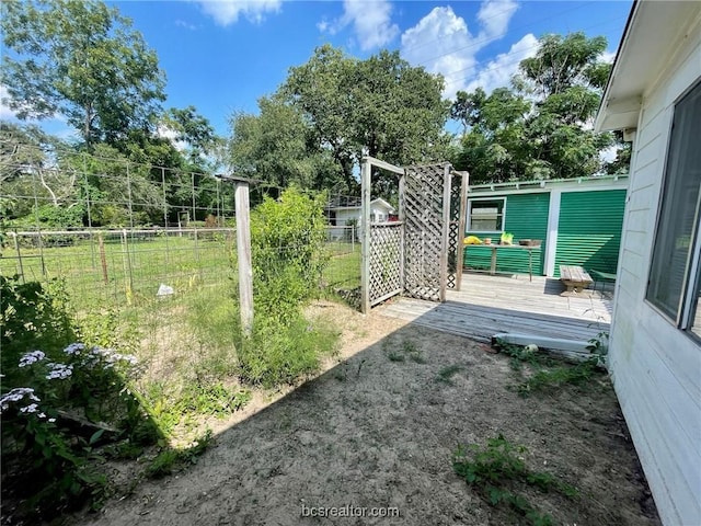 view of yard with a wooden deck