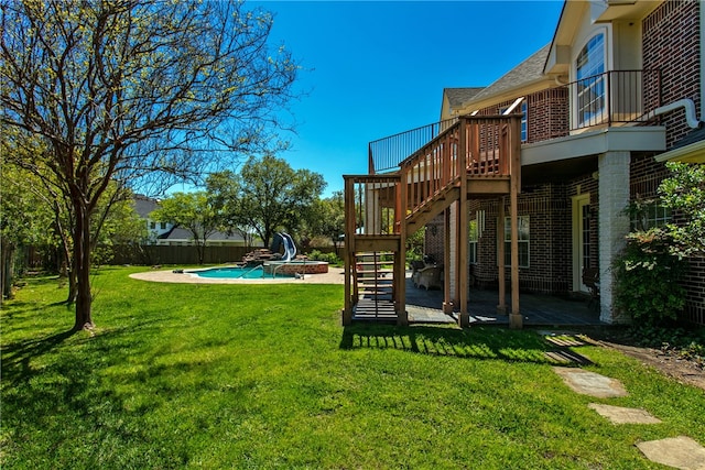 view of yard with a patio, fence, stairway, and a deck