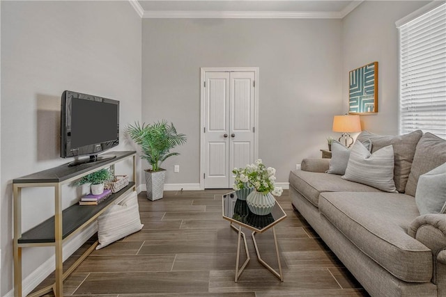 living room with dark hardwood / wood-style flooring and ornamental molding