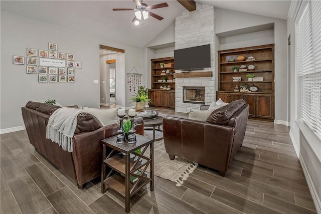 living room featuring ceiling fan, vaulted ceiling with beams, dark hardwood / wood-style flooring, built in features, and a fireplace