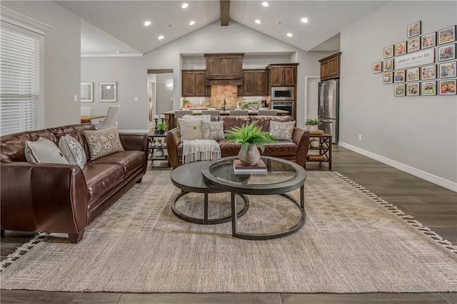 living room with lofted ceiling with beams and dark wood-type flooring