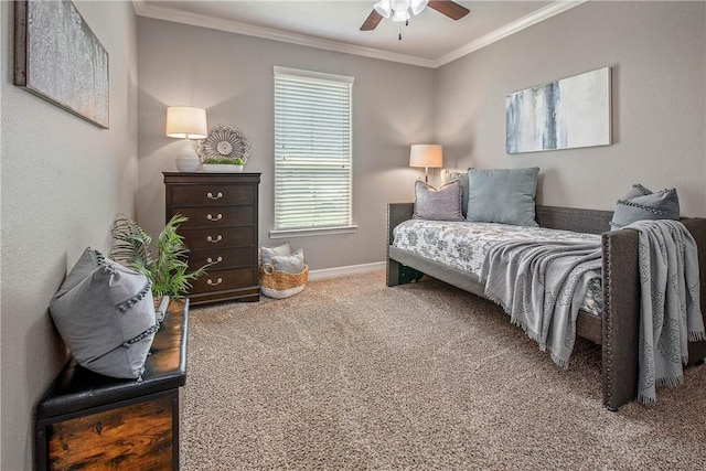 bedroom featuring ceiling fan, crown molding, and carpet floors