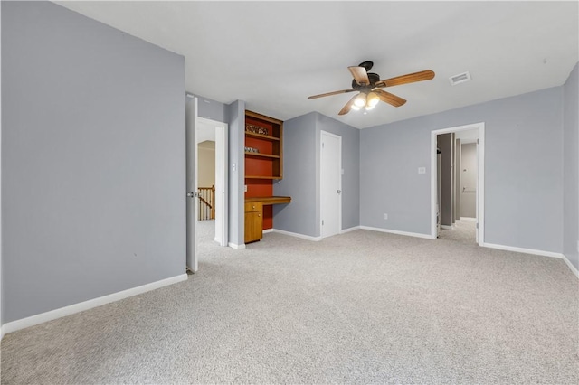 1205 King Arthur Cir, College Station, TX 77840 - empty room featuring carpet floors, a ceiling fan, and baseboards