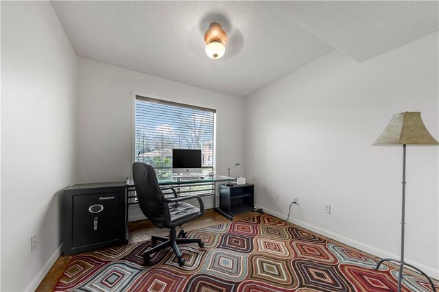 1205 King Arthur Cir, College Station, TX 77840 - office area featuring baseboards and a textured ceiling