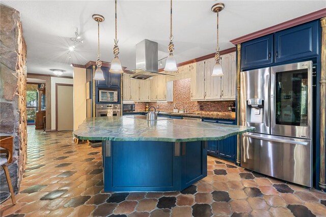 1309 Rock Dam Rd, Marlin, TX 76661 - kitchen with blue cabinetry, appliances with stainless steel finishes, island exhaust hood, a center island with sink, and decorative backsplash