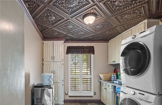 1309 Rock Dam Rd, Marlin, TX 76661 - washroom featuring cabinet space, an ornate ceiling, and stacked washing maching and dryer