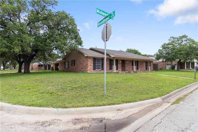 ranch-style house with a front lawn