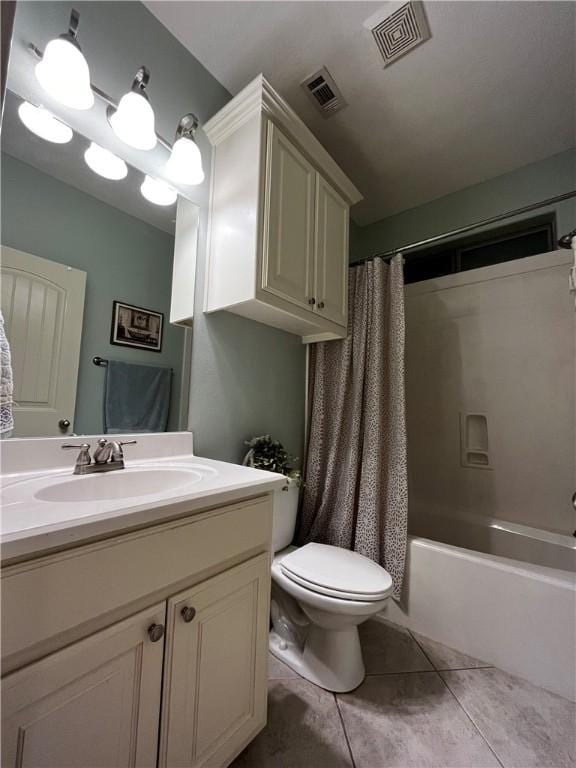 bathroom featuring vanity, shower / bath combo, tile patterned flooring, and visible vents