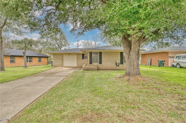 single story home with a garage and a front lawn