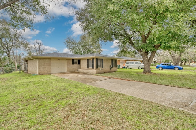 ranch-style house with a garage and a front lawn