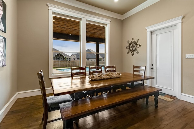4675 River Garden Ct, Bryan, TX 77808 - dining space featuring wood finished floors, crown molding, and baseboards