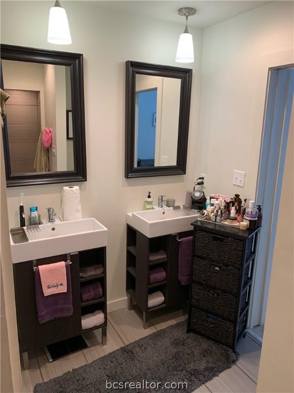 bathroom featuring hardwood / wood-style flooring and vanity