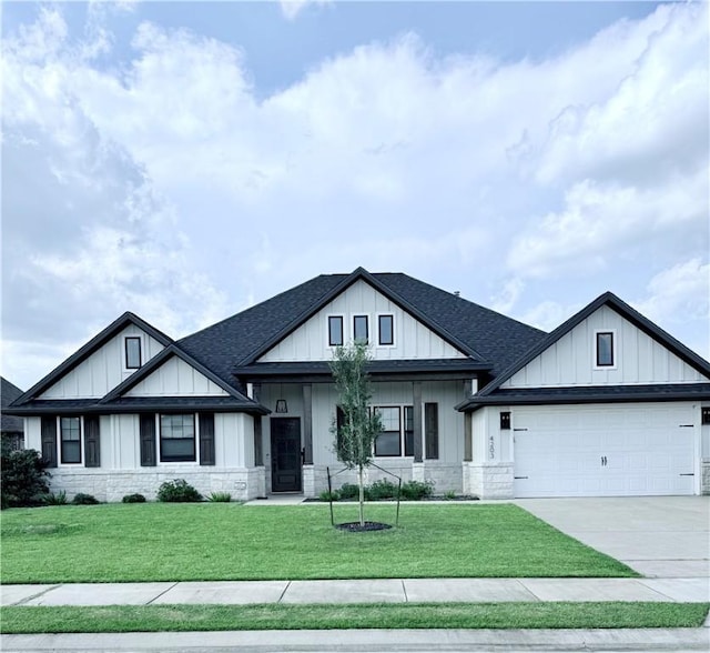 4203 Lismore Ln, College Station, TX 77845 - modern farmhouse with driveway, roof with shingles, and a front lawn