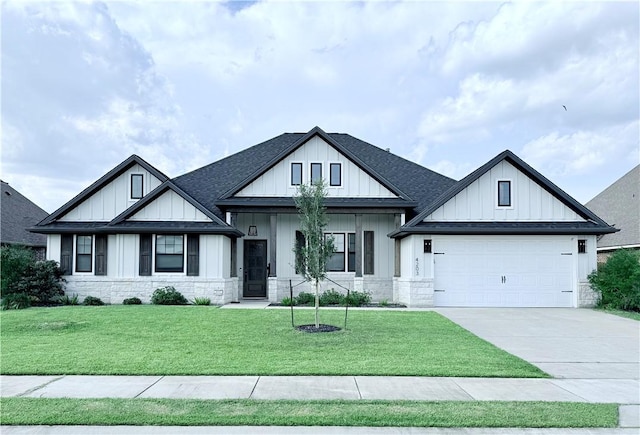 4203 Lismore Ln, College Station, TX 77845 - modern inspired farmhouse featuring driveway, stone siding, a garage, a front yard, and a shingled roof