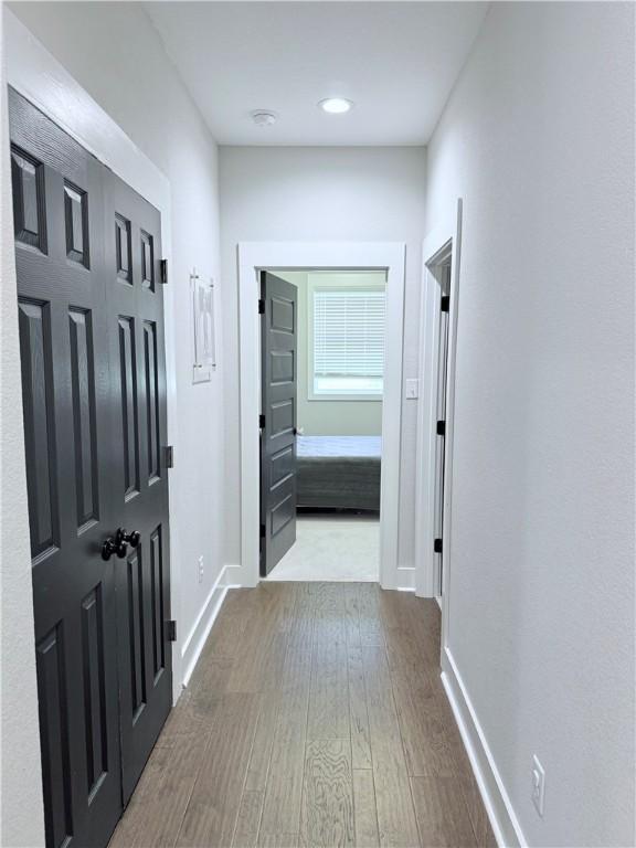 4203 Lismore Ln, College Station, TX 77845 - corridor with dark wood-style flooring and baseboards