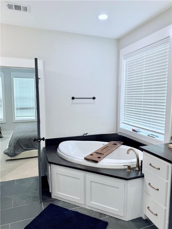 4203 Lismore Ln, College Station, TX 77845 - full bathroom with a bath, ensuite bath, and tile patterned flooring