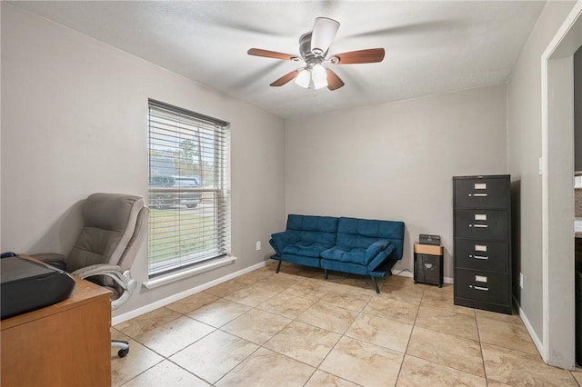 home office with light tile patterned floors, a wealth of natural light, and ceiling fan