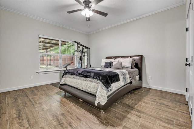 2102 Cary Cir, Bryan, TX 77803 - bedroom with wood finished floors, crown molding, and ceiling fan