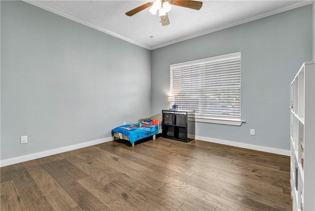 2102 Cary Cir, Bryan, TX 77803 - unfurnished bedroom with wood finished floors, ornamental molding, and ceiling fan