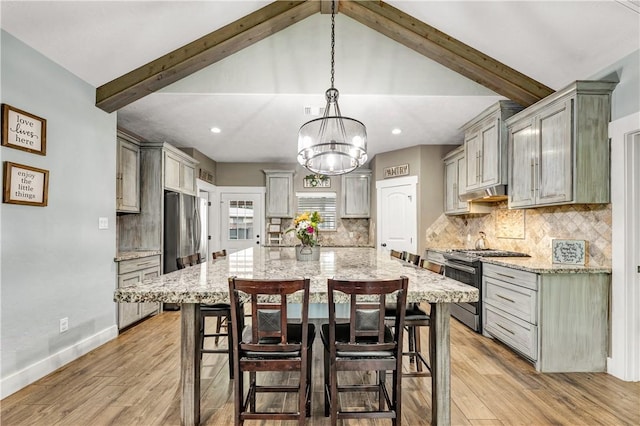 2102 Cary Cir, Bryan, TX 77803 - kitchen featuring stainless steel appliances, gray cabinetry, light wood finished floors, and recessed lighting