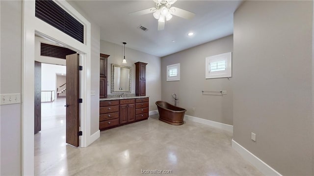 bathroom with vanity, ceiling fan, and concrete floors