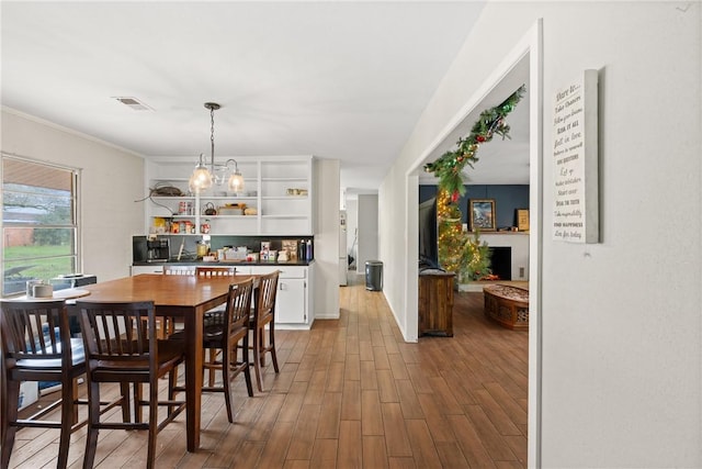 dining area with hardwood / wood-style floors