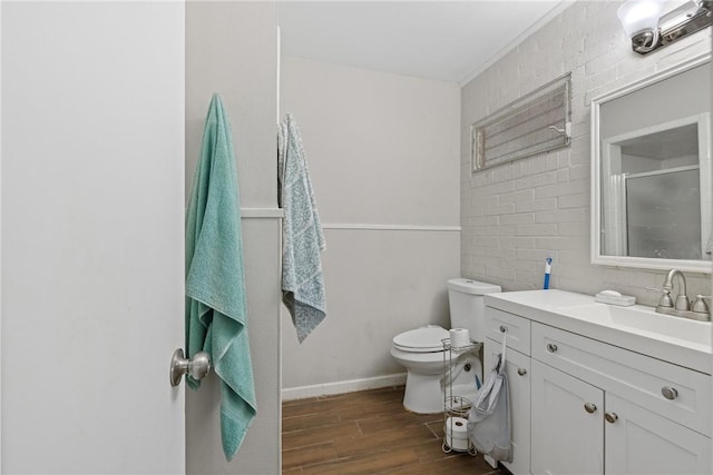 bathroom with vanity, a shower with shower door, and toilet