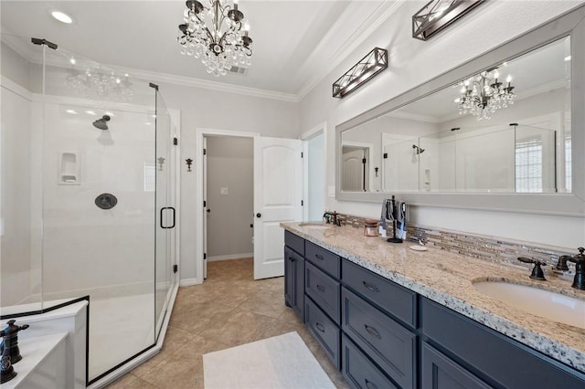 bathroom featuring ornamental molding, vanity, a notable chandelier, and walk in shower