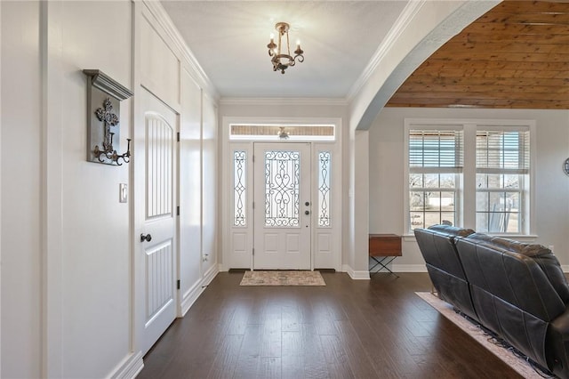 entryway featuring crown molding and dark hardwood / wood-style floors