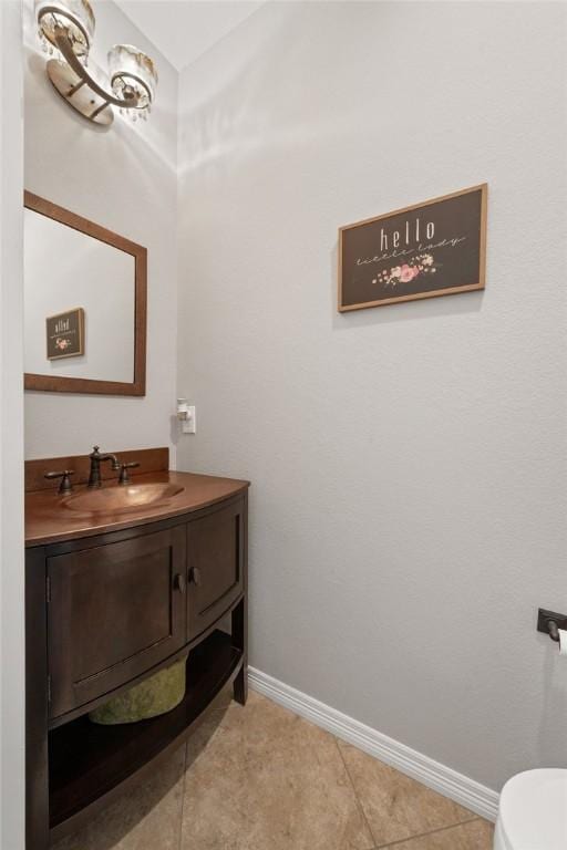 bathroom with tile patterned flooring and vanity