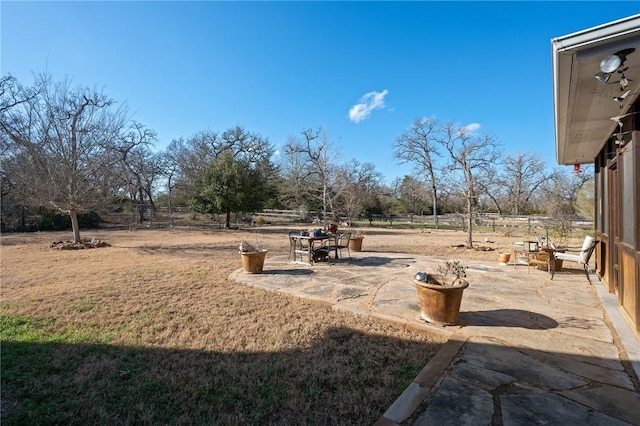 view of yard featuring a rural view and a patio area