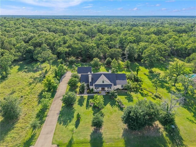 10187 Hampton Ct, Iola, TX 77861 - aerial view of property and surrounding area featuring a heavily wooded area
