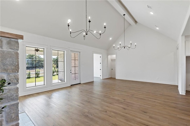 unfurnished living room with beamed ceiling, hardwood / wood-style floors, and high vaulted ceiling