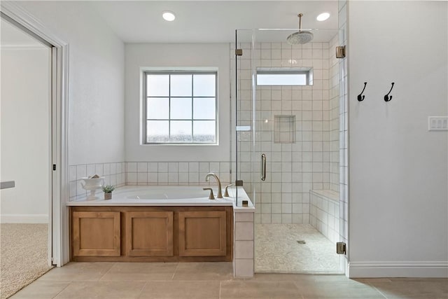 bathroom featuring tile patterned flooring and plus walk in shower