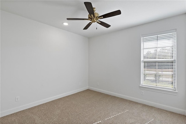 unfurnished room with carpet floors and ceiling fan