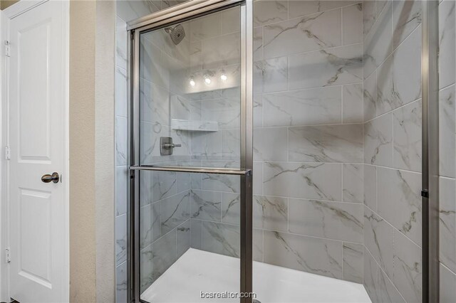 bathroom with an enclosed shower