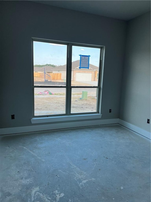 5307 Lyle Pl, Bryan, TX 77807 - spare room featuring unfinished concrete floors and baseboards