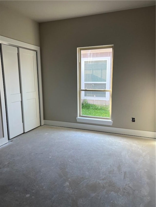 5307 Lyle Pl, Bryan, TX 77807 - unfurnished bedroom with unfinished concrete floors and a closet