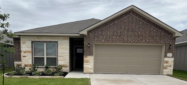 5307 Lyle Pl, Bryan, TX 77807 - single story home with stone siding, driveway, an attached garage, a shingled roof, and brick siding