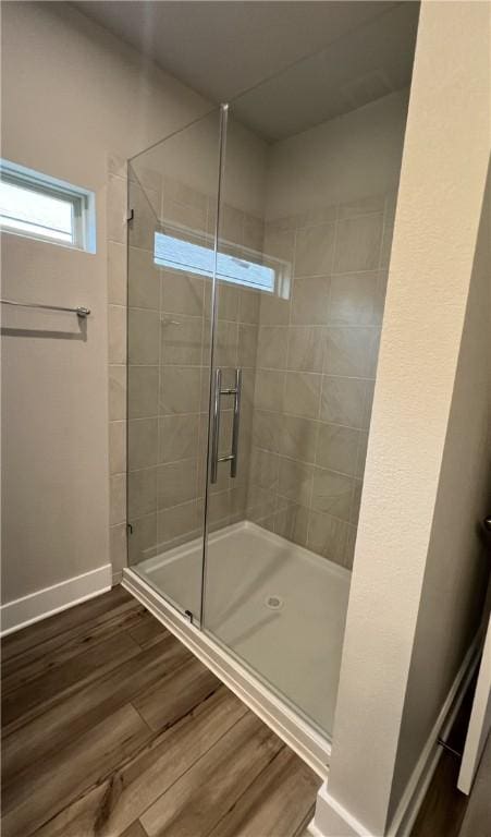 5307 Lyle Pl, Bryan, TX 77807 - bathroom featuring a stall shower and wood finished floors