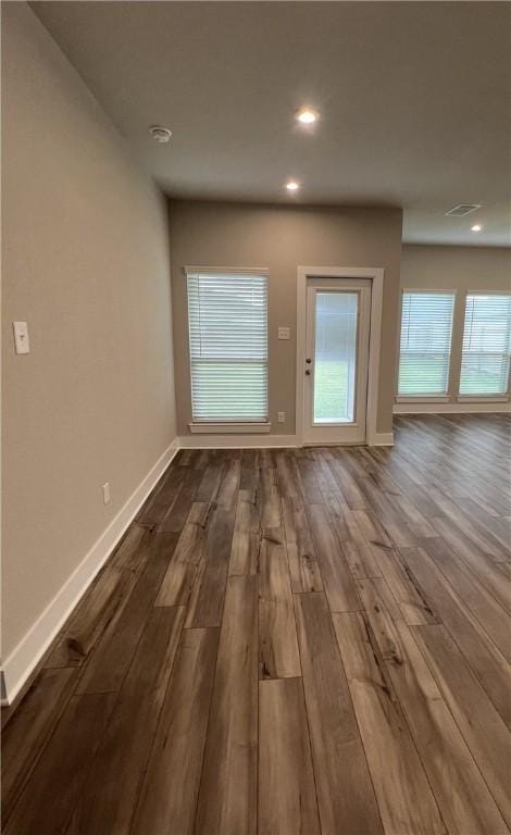 5307 Lyle Pl, Bryan, TX 77807 - unfurnished living room featuring dark wood-style floors and recessed lighting