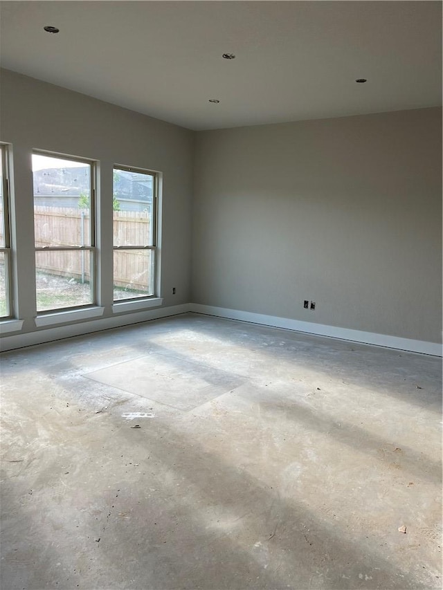 5307 Lyle Pl, Bryan, TX 77807 - empty room featuring unfinished concrete floors and baseboards