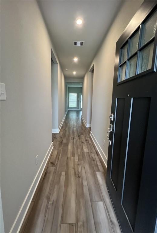 5307 Lyle Pl, Bryan, TX 77807 - hallway featuring dark wood-type flooring and baseboards