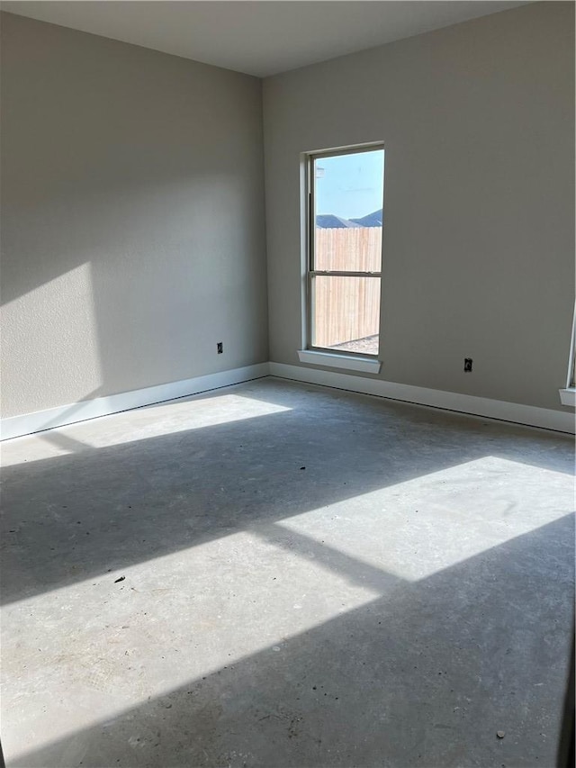 5307 Lyle Pl, Bryan, TX 77807 - empty room with concrete floors and baseboards