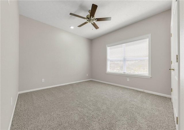 unfurnished room featuring carpet flooring and ceiling fan