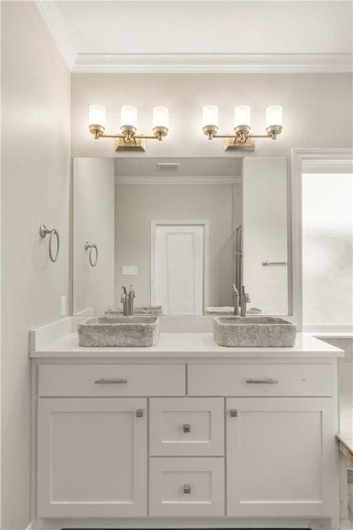 2816 Bombay Dr, Bryan, TX 77808 - bathroom with vanity and ornamental molding