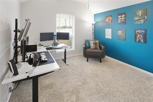 office area featuring carpet floors and vaulted ceiling