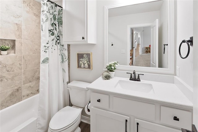 full bathroom with shower / bathtub combination with curtain, vanity, and toilet